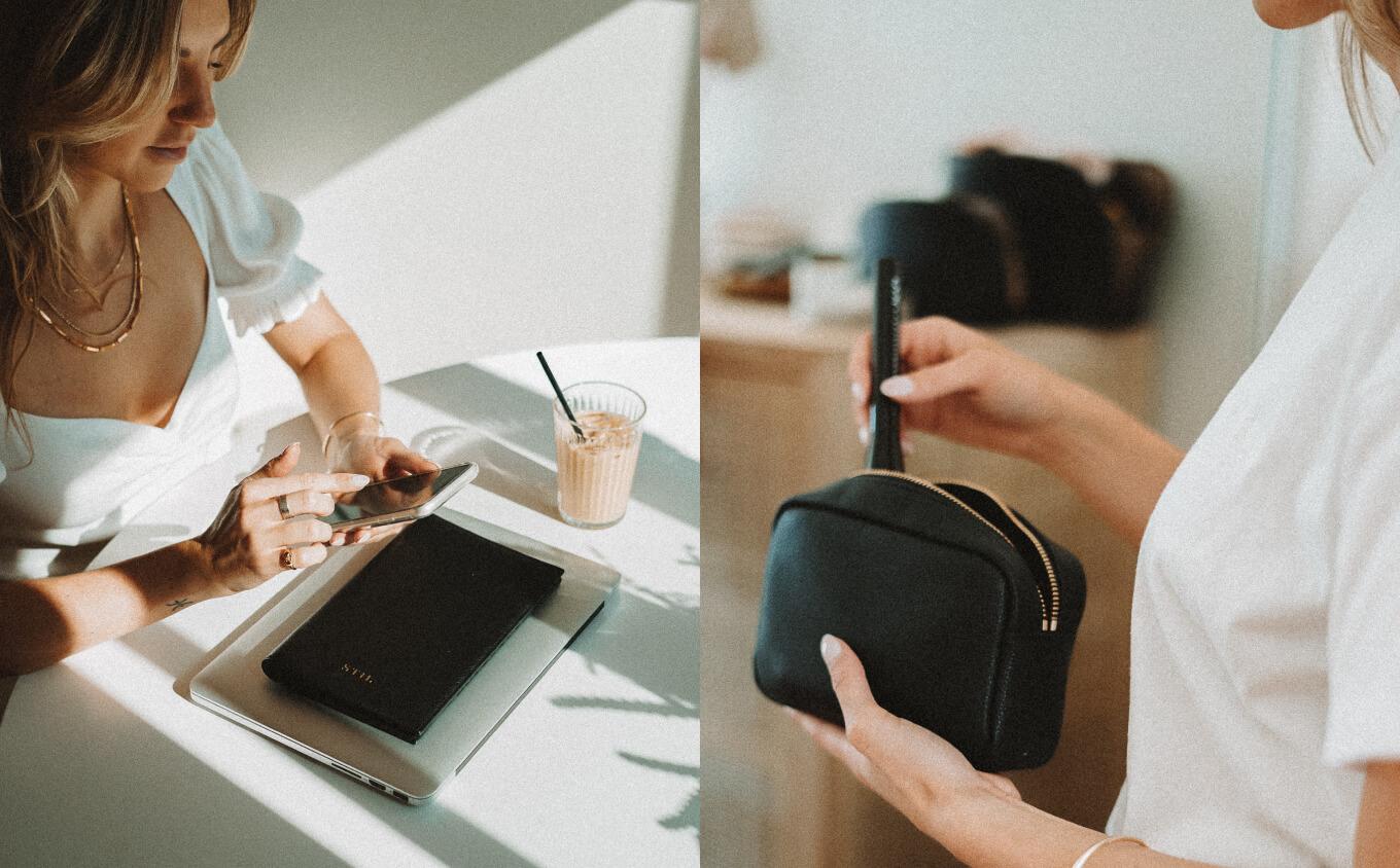 Woman on smartphone with Stil journal in black resting on laptop next to image of woman holding Stil makeup bag