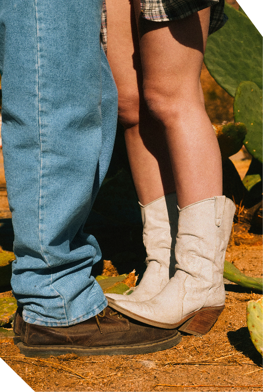 Two people standing in cowboy boots